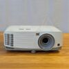 Cheapest-projector-rental-in-Greater-Vancouver White ViewSonic projector available for rental in Greater Vancouver, shown from the front-side angle