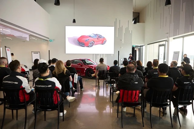 AV-Setup-for-autodealer-presentation-in-langley group of people in showroom watching a presentation