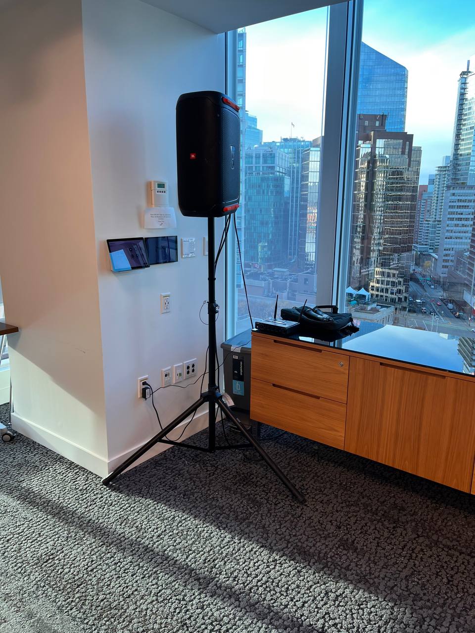 Professional audio equipment rental with a tripod-mounted speaker and lectern ready for a Vancouver corporate presentation