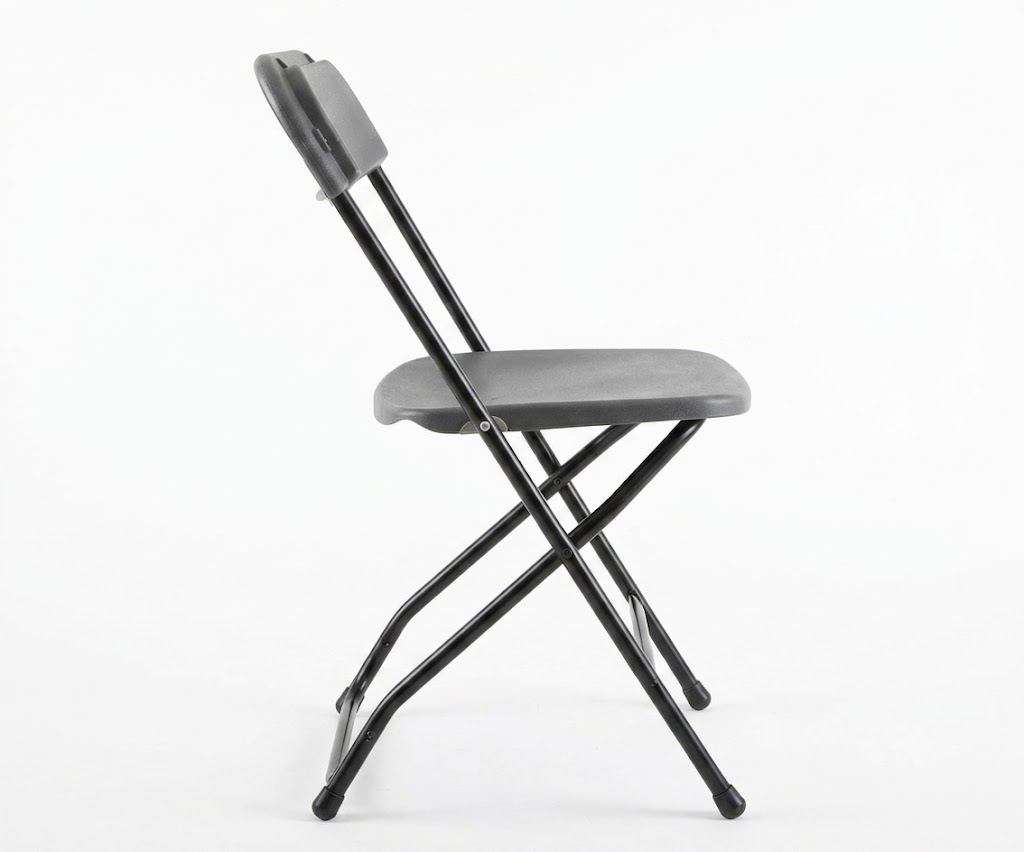 Black Folding Chair Rental Side View Open Position Side view of a black folding chair rental with crossed metal legs and plastic seat and backrest, photographed on a white background