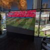 Burnaby-LED-Video-Wall-Rental-for-FIFA-Game Indoor LED wall rental showing a FIFA World Cup corner kick moment at a packed Vancouver restaurant watch party