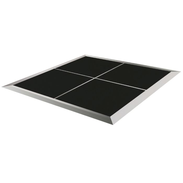 Modular black dance floor tiles assembled with sloped metallic trim