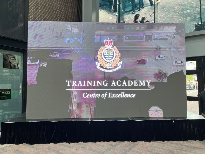 Vancouver Police Training Academy storefront with main stage and rows of guest chairs